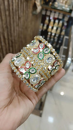 Gold Kundan Bangles with Red-Green Crystal Accents and Stone Detailing