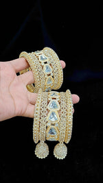 Luxury Gold-Plated Bridal Bangles with Crystal Stones & Jhumka Tassels