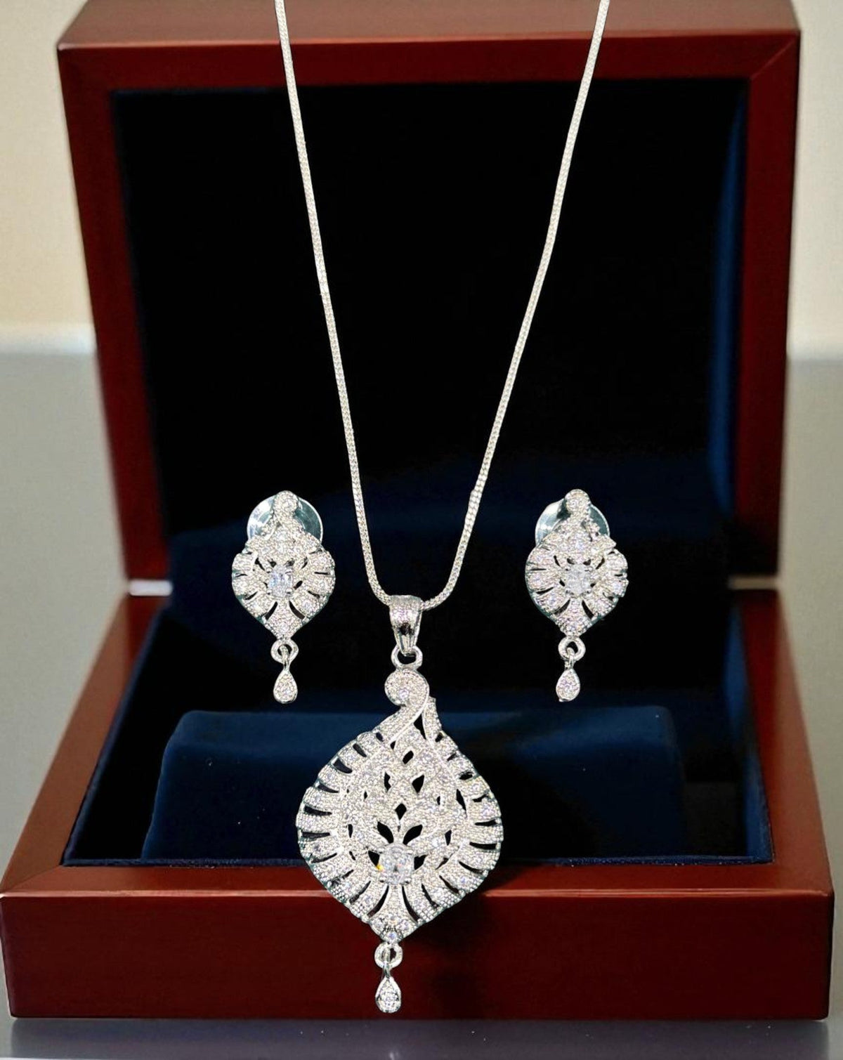 Elegant Silver Crystal Leaf Pendant Necklace Set with Matching Drop Earrings Party & Festive Wear