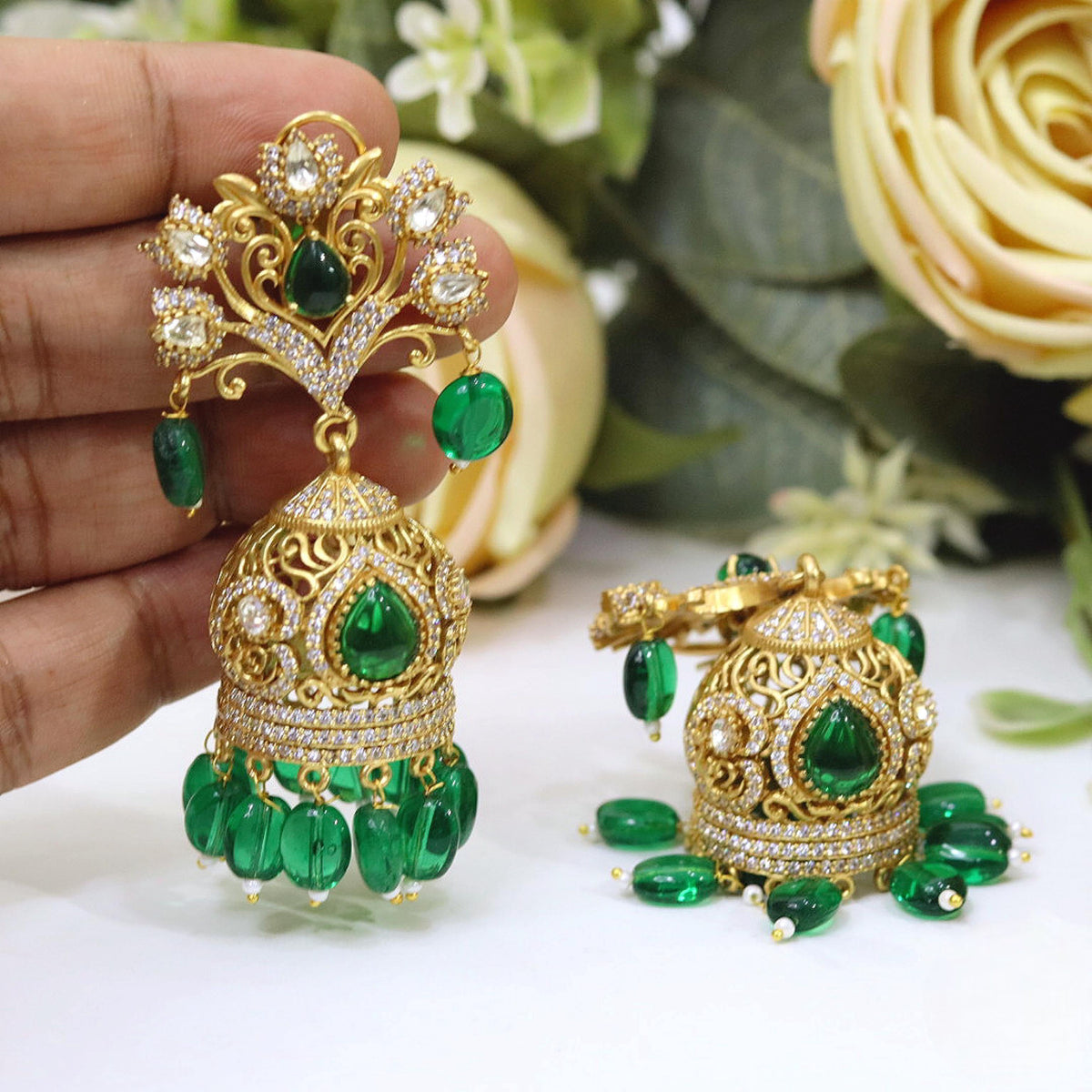 Antique Gold-Plated Jhumka Earrings with Royal Blue Stones and Filigree Peacock Studs