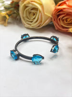 Elegant Black-Plated Open Bangle with Blue Crystal Stones – Modern Fashion Jewelry